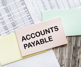 Business concept. Text ACCOUNT PAYABLE on the yellow sticker on payment documents